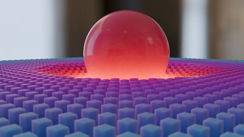 A sphere pressing into a grid of cube instances using distance based falloff