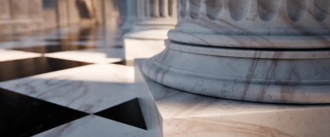 A marble colonnade leading to a statue in a lit alcove